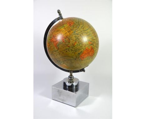 A Jacques Adnet terrestrial globe lamp, nickel plated base. Paper covered glass globe. By Girard Barrere. Circa 1930. Height 