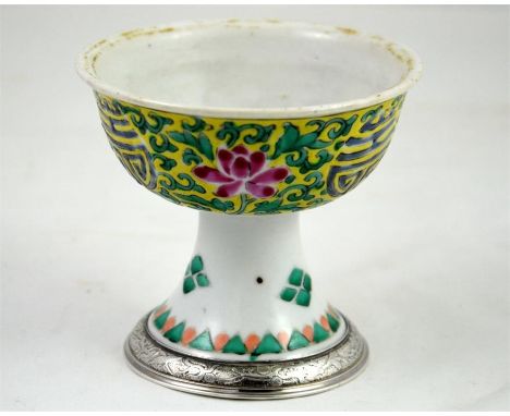 A 18th century Chinese stem cup with a silver mount. Height 9cm.