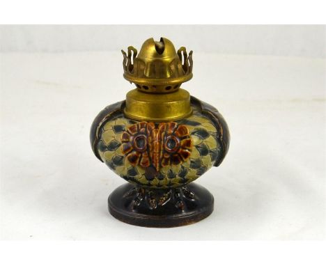 A Doulton Lambeth oil lamp in the form of an owl. Impressed marks. Dated 1884. Height 8cm.