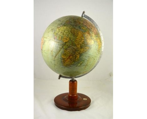 A globe made in Germany, circa 1938. Made after the German occupation of Austria (Anschluss). Wooden base set with a compass.