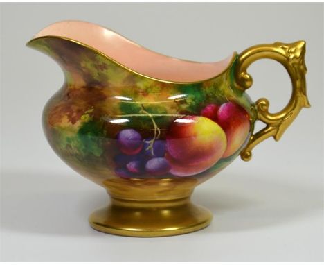 A Royal Worcester creamer, with fruit decoration, signed E. Townsend and date code for 1929. Printed marks. Height 7.5cm.