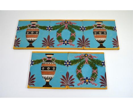 A frieze of five Minton majolica tiles. Circa 1880. Each tile 20cm x 20cm.