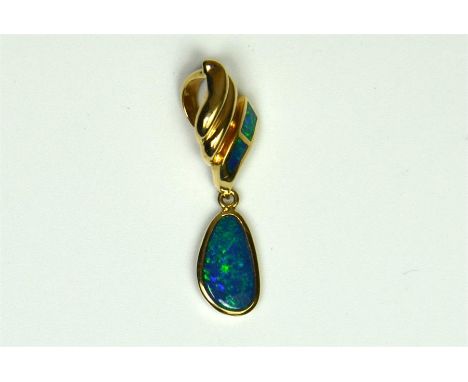 A 14ct yellow gold Lightening Ridge 13mm opal pendant, suspended from a 16mm top inlaid with opal. Thought to be Boulder opal