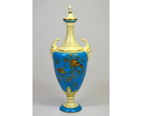 A Royal Worcester vase and replacement cover, with birds of paradise raised paste gilded decoration by T. Moreton and dated 1