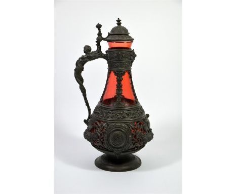 A 19th century Bohemian base metal ruby glass claret jug, Renaissance style. Height 37cm.