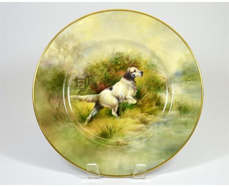 A bone china plate, hunting dog scene, signed R. Budd (a former Royal Worcester artist). Printed marks. Diameter 27cm.