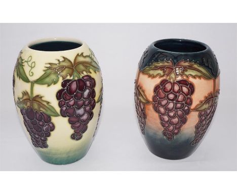Two Moorcroft trial vases, decorated with grapes. Dated 1996. Printed marks. First quality. Height 14cm. (2)