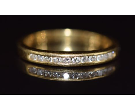 An 18k gold half eternity ring set with diamonds, 2.5g, size K