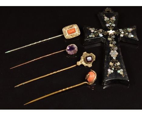 Victorian jet cross pendant inlaid with mother of pearl and four Victorian stick pins, two set with coral&nbsp;