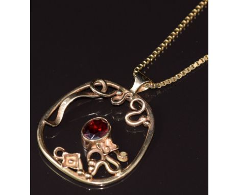 A 9ct gold pendant&nbsp;set with a garnet in an abstract design, on 9ct gold chain made up of box links, London 1979, 22.5g&n