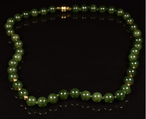 A necklace of nephrite jade&nbsp;and gold beads&nbsp;with 18ct gold clasp