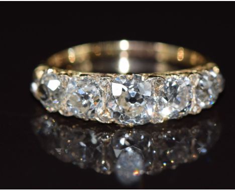 Victorian 18ct gold ring set with five old cut diamonds and rose cut diamonds, the centre diamond approximately 0.8ct and tot