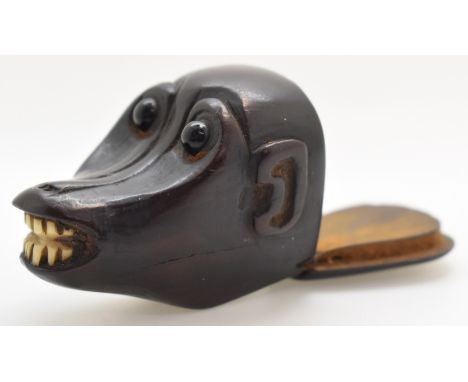 An 18th/19thC carved hardwood figural baboon or monkey snuff box with bone teeth and glass eyes, possibly Japanese, H3 x L4.5