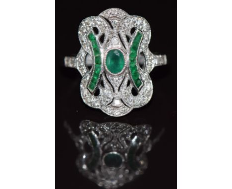 An 18ct white gold ring set with diamonds and emeralds in an Art Deco style, 4.8g, size R