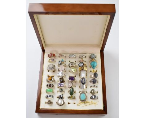 Forty four silver rings including pearl, amethyst, tiger's eye, peridot, rose quartz, etc