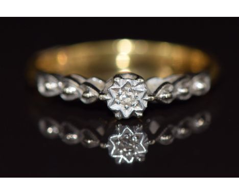 An 18ct gold ring set with a diamonds in a platinum setting, 2.6g, size L