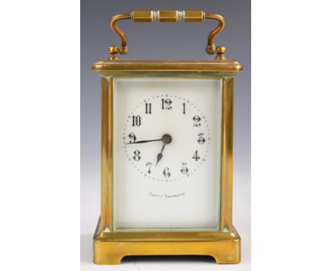 19th or early 20thC brass cased carriage clock, with retailer's name to the white enamel dial, height including handle 14.5cm
