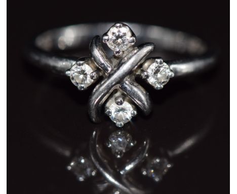 Tiffany &amp; Co platinum ring set with four diamonds in a cross setting, maker 'Schlumberger Studios Tiffany &amp; Co PT950'