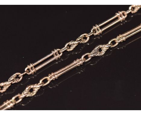 A c1900 9ct rose gold watch chain/ necklace made up of elongated and knotted links, 37.6g, 73cm&nbsp;