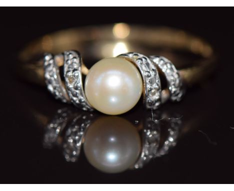A 9ct gold ring set with a cultured pearl and diamonds, 1.9g, size V