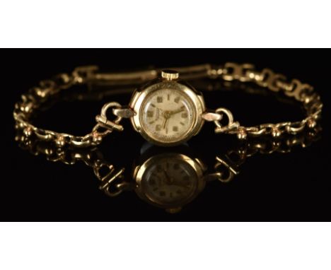 Rotary 9ct gold ladies wristwatch with gold hands and Arabic numerals, silver dial and movement, on 9ct gold bracelet, case d