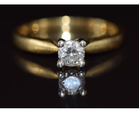 An 18ct gold ring set with a round cut diamond of approximately 0.3ct, 2.8g, size K