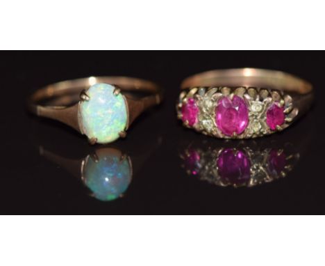 Two 9ct gold rings, one set with synthetic sapphires and the other opal, 3.8g, size R &amp; P&nbsp;