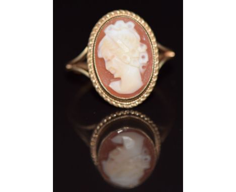 A 9ct gold ring set with a cameo depicting a young woman, 3.2g, size K