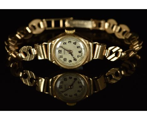 Rotary 9ct gold ladies automatic wristwatch with gold hands and Arabic numerals, silver dial and mechanical movement, on 9ct 
