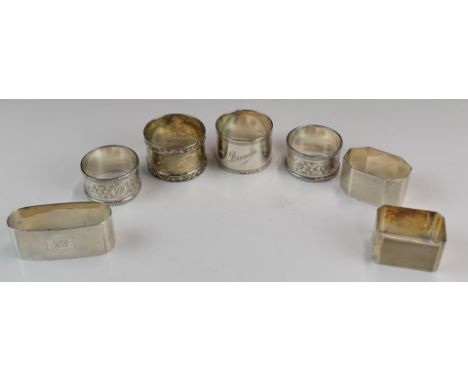 Seven various hallmarked silver napkin rings including a pair of Art Deco style engine turned octagonal examples and a furthe