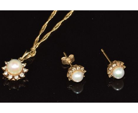 A 9ct gold pendant set with a pearl and diamonds, with matching earrings, 4.3g&nbsp;