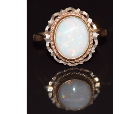 A 9ct gold ring set with an opal, 2.4g, size K