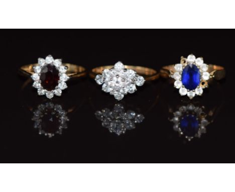 Three 9ct gold rings, one set with a synthetic sapphire, one garnet and the other cubic zirconia, 5.9g, size M, K &amp; L