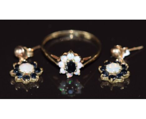 A 9ct gold ring set with a sapphire surrounded by opals (size M) and a pair of 9ct gold earrings each set with an opal surrou