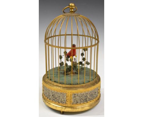 Automaton clockwork singing bird in cage, marked to base Western Germany, height 24cm