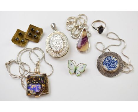 A collection of jewellery including silver pendant set with Blue John, Victorian silver locket (Birmingham 1881), opal pendan