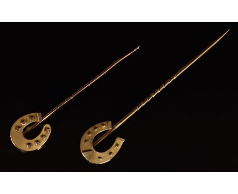 Two 9ct gold stick pins in the form of horseshoes, Birmingham 1894 and 1896, 2g