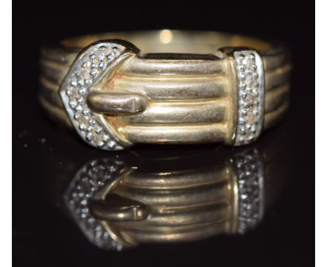 A 9ct gold buckle ring set with diamonds, 4.5g, size R