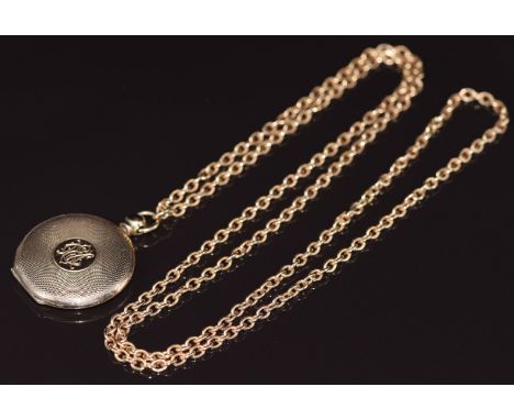 A c1920 9ct gold engine turned locket on 9ct gold chain, 22.4g&nbsp;