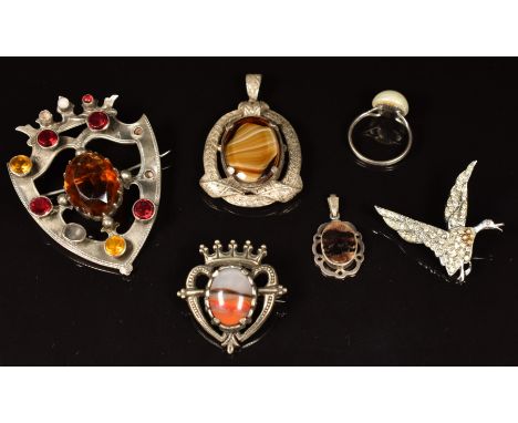 A large silver brooch set with paste, Miracle pendant and brooch, silver ring set with a pearl, and a silver pendant set with