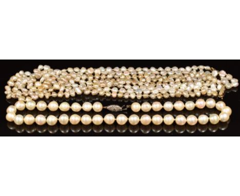Three pearl necklaces, one with 14k white gold clasp the others with 18k gold clasps