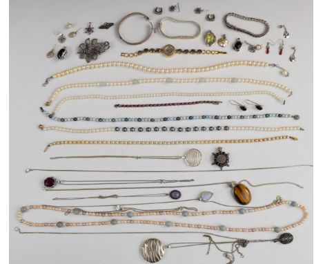 Thirteen silver pendants, silver brooch, silver bangle, six pairs of silver earrings, seven pearl necklaces two with gold cla