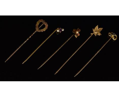 Four 9ct gold stick pins, including one in the form of a heart, Chester 1901, one set with a diamond, one with amethyst and s