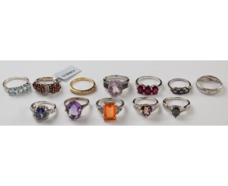 A 9k white gold ring (0.7g) and eleven silver rings including ruby, amethyst, topaz, etc&nbsp;