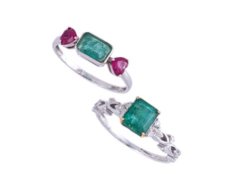 TWO EMERALD AND GEMSTONE DRESS RINGS
To include a emerald and ruby three stone ring, mounted in white gold marked 'G18K' for 