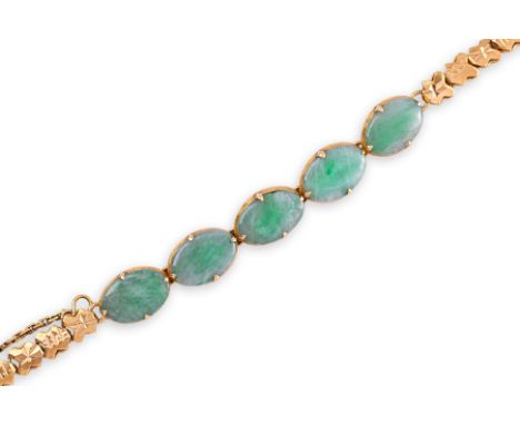 A JADE AND GOLD BRACELET
Featuring five jade pieces mounted in a yellow gold setting with Chinese marks, likely high karat.
1