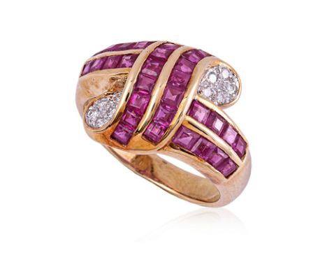 A RUBY AND DIAMOND RING
Featuring square cut rubies totalling approximately 2.03 Cts (marked), mounted in a yellow gold setti