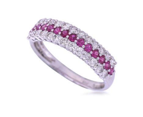 A RUBY AND DIAMOND THREE ROW HALF ETERNITY RING
Featuring round cut rubies totalling approximately 0.42 Cts, mounted in a whi