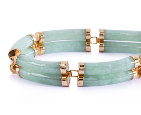 A JADE LINK BRACELET
Featuring green jade pieces mounted in a yellow gold setting marked '14K' '585' to the clasp.
17.6cm
21.