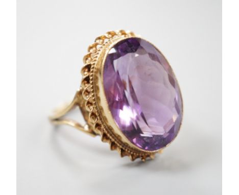 A 1970's 9ct gold and amethyst set dress ring, size O/P gross weight 6.1 grams.